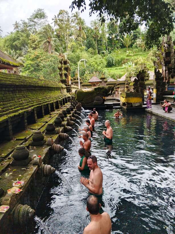Bali: Rice terrace, Waterfall, and water Temple Day Tour - Kanto Lampo: rock ledges made for water and photos