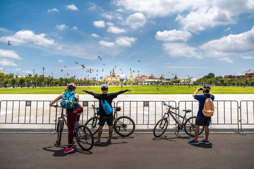 Bangkok: Backstreets and Historic Temples Bike Tour - Passing the Grand Palace and entering a former royal park