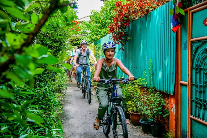 Bangkok: Backstreets and Temple Historic Bike Tour - Crossing the Rama VIII Bridge for a wider view