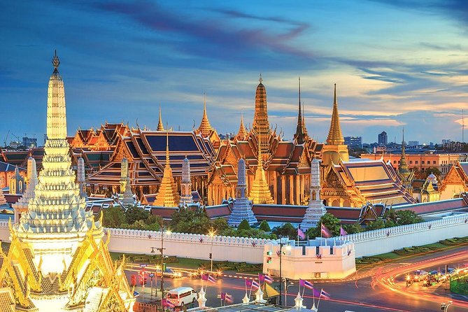 Bangkok Night Lights: Temple & City Tour by Tuk Tuk (SHA Plus) - Seeing the Grand Palace lit from the roadside