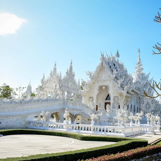 Chiang Mai: Chiang Rai Famous Temples & Hot Springs Day Trip - Wat Rong Suea Ten Brings a Blue Contrast