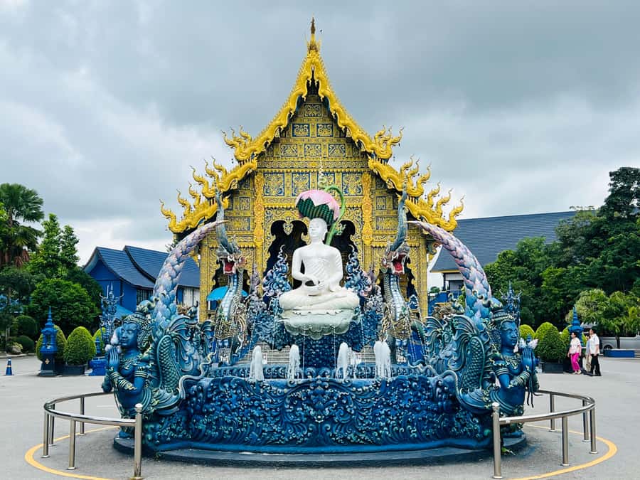 Chiang Rai:Private Transfer to Chiang Mai with Temples Visit - Wat Rong Suea Ten, blue from floor to ceiling