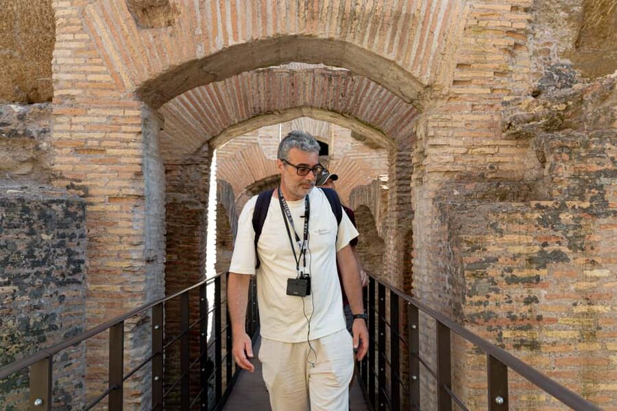 Colosseum Special Access Tour, with Ancient Temples & Tombs - Entering the Colosseum through the Gladiators’ Gate