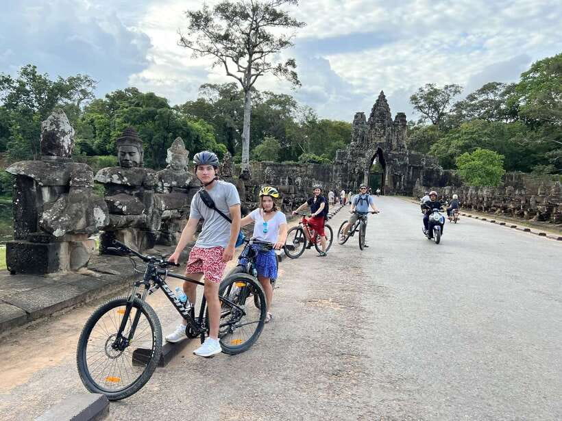 Explore Angkor Wat by Bike and Sunset - 11:00 am: Ta Prohm and the trees over the ruins
