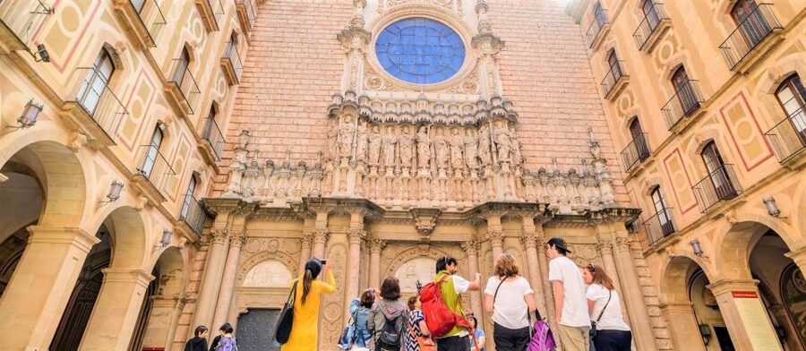 From Barcelona: Montserrat Monastery & Scenic Mountain Hike - Entering the Benedictine monastery