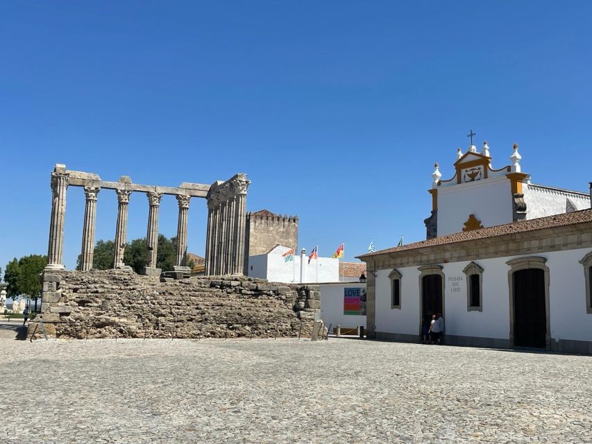 From Lisbon: Évora, Chapel of Bones, & Roman Temple Tour - Walking into Évora’s medieval center