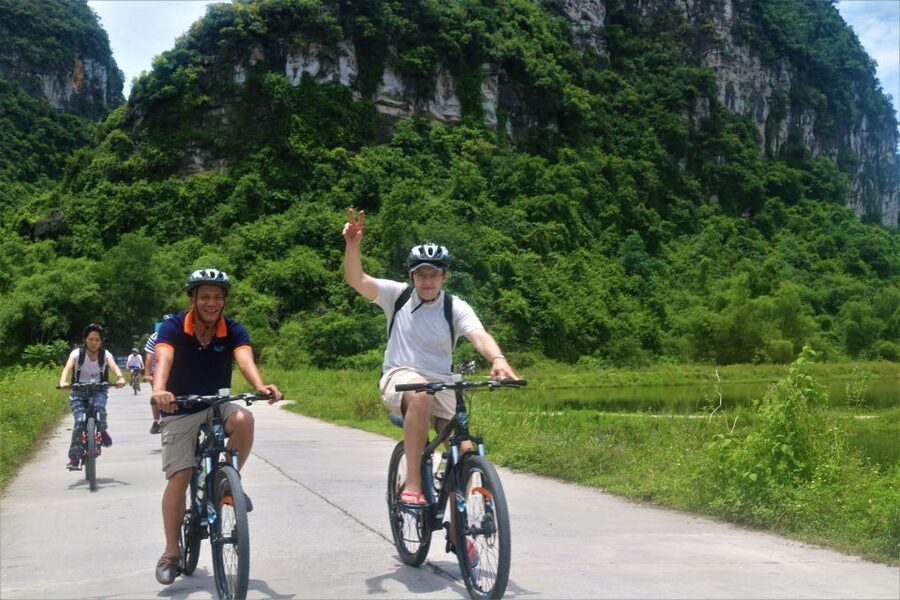 Full Day Trang An, Bich Dong Pagoda, Biking & Family Visit - Climbing through Bich Dong Pagoda