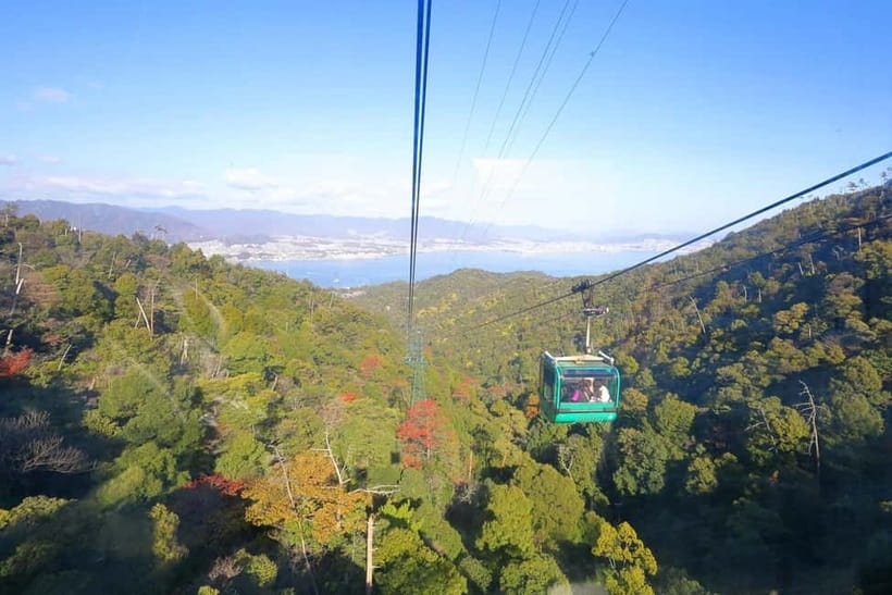 Hiroshima: Itsukushima Shrine and Miyajima Summit Tour - Taking the ropeway toward Miyajima’s high ground