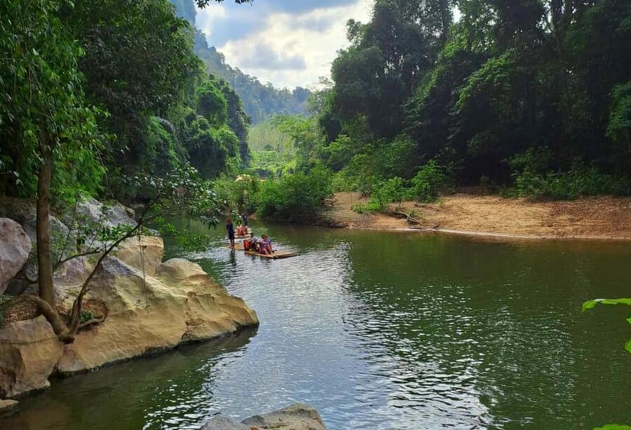 Khao Sok: Private Bamboo Rafting & Jungle Cave Temple Tour - Feeding fish adds a simple bit of fun
