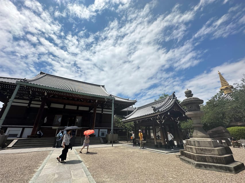 Osaka: Japan’s Oldest Temple & Bone Buddha Walking Tour - Walking toward Isshinji’s modern entrance