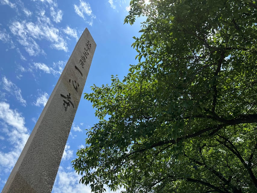 Osaka: Japan’s Oldest Temple & Bone Buddha Walking Tour - Meeting at Shitennoji’s stone torii