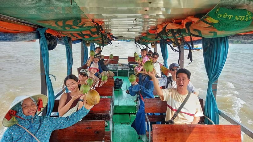 Private Tour to Mekong Delta & Vinh Trang Pagoda 1 Day - The sampan through coconut-lined canals