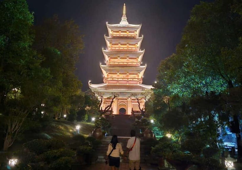 Sacred Nights at Bai Dinh Pagoda: A Spiritual Escape - Seeing the tall stupa from the night route