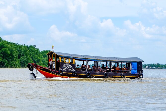 Small-Group Mekong Delta Day Trip: Boat Ride, Cottages & Pagoda - A hand-rowed boat through the smaller canals