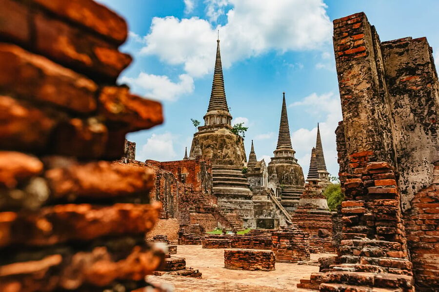 The Old Siam: Ayutthaya Temples Small Group Tour with Lunch - Wat Maha That and the Buddha head in the tree roots