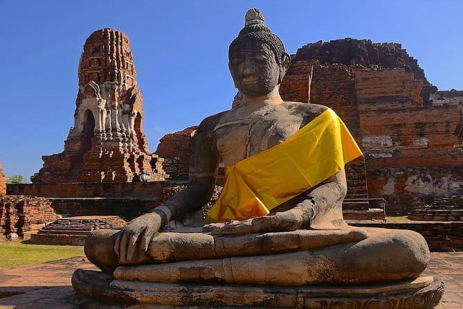 Three Temple Ayutthaya Tour with Scenic Boat Ride - The guide, pacing, and group experience