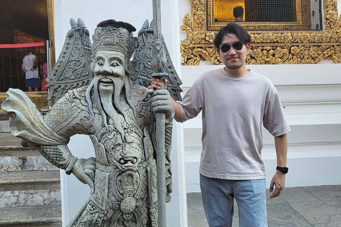 Visit Wat Pho and Wat Arun with Local Expert - Wat Arun’s decorated spires by the river